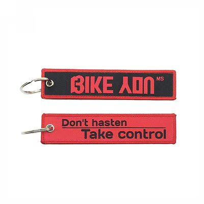 คาราไบเนอร์ที่กําหนดเอง การเย็บผ้าขัดเจ็ท แท็กตัวกุญแจ Eagle Beak Black Wrist Strap Lanyard Keychain